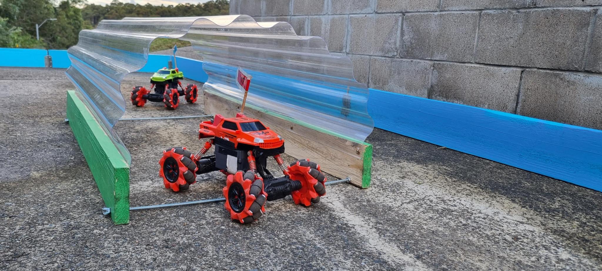 RC cars driving through tunnel obstacle – view 2